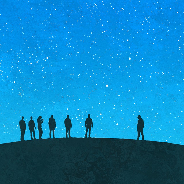 Illustration of seven people standing in silhouette on a hilltop beneath a night sky full of stars